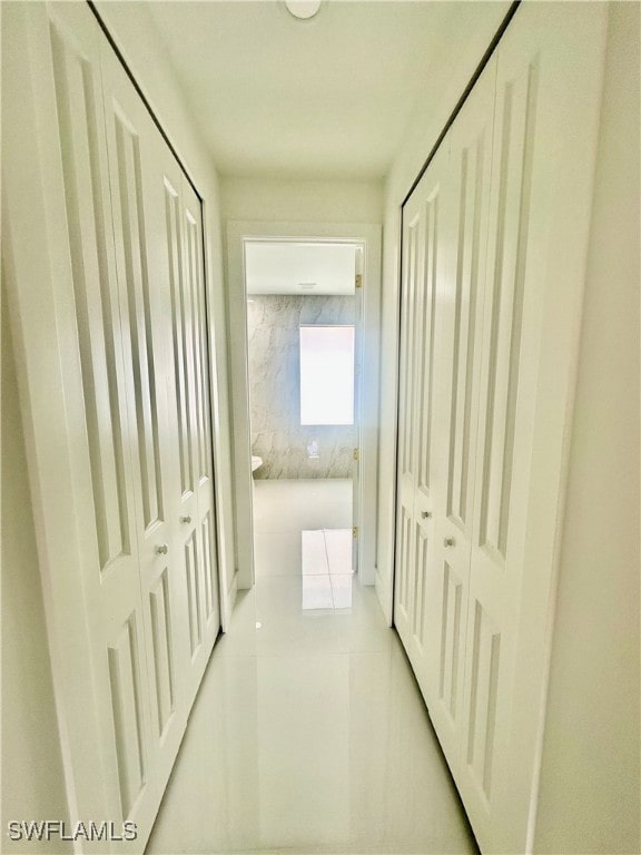 hallway featuring light tile patterned floors