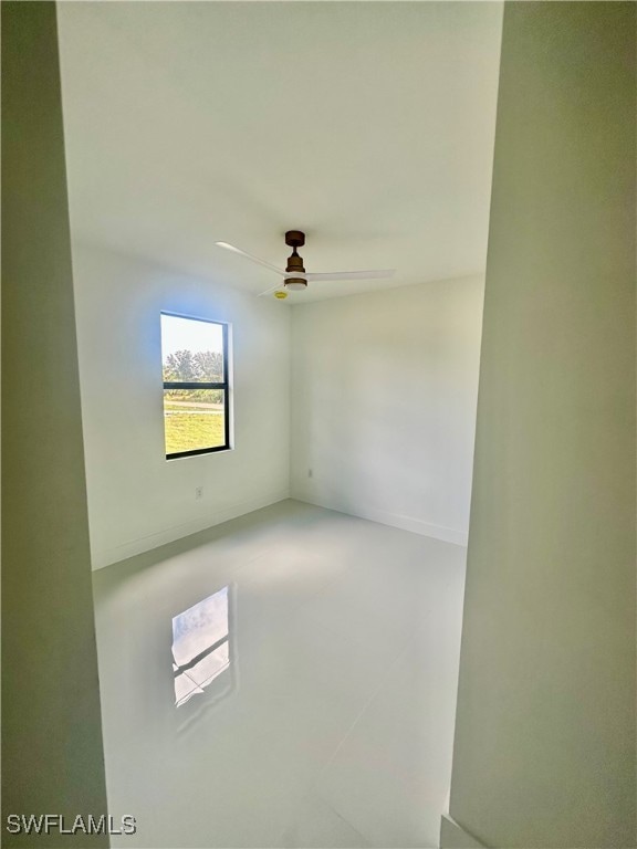 spare room with ceiling fan