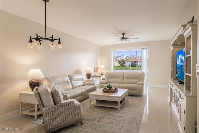 tiled living room featuring ceiling fan with notable chandelier