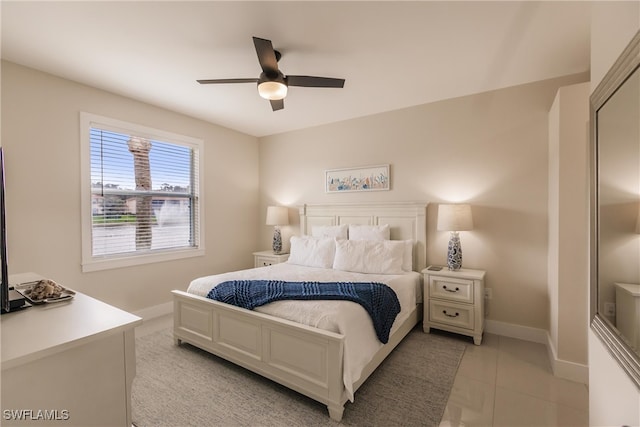 bedroom featuring light tile patterned flooring and ceiling fan