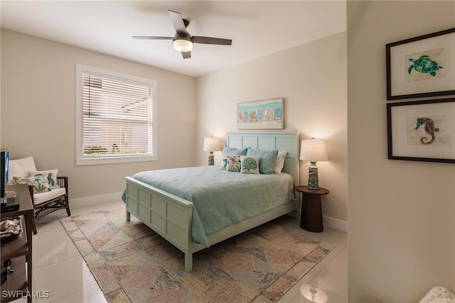 tiled bedroom with ceiling fan