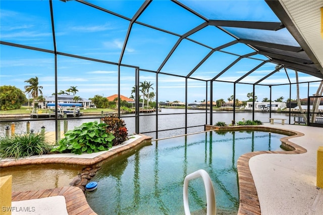 view of swimming pool with glass enclosure and a water view