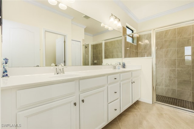 bathroom featuring vanity, a shower with door, tile patterned floors, and ornamental molding