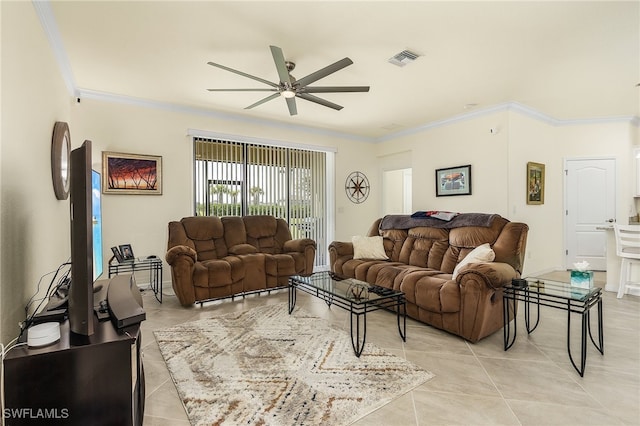 tiled living room with ceiling fan and ornamental molding