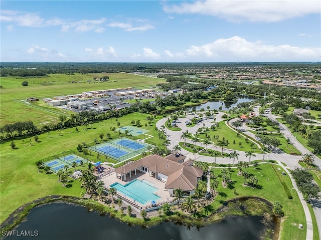 birds eye view of property with a water view