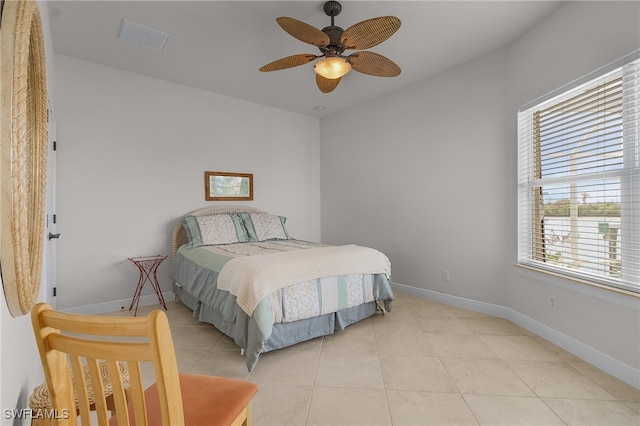 tiled bedroom with ceiling fan