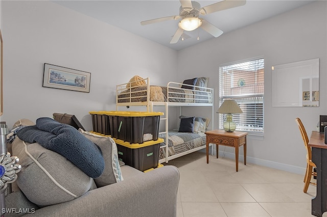 bedroom with ceiling fan and tile patterned flooring