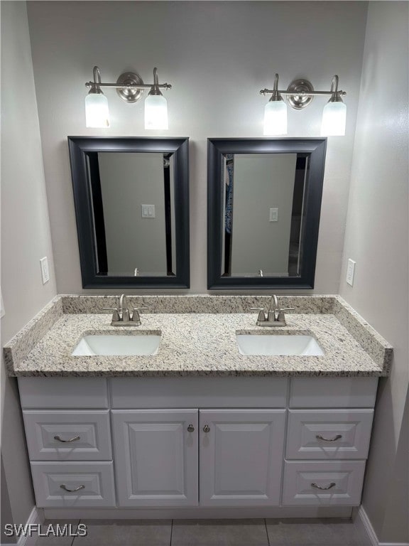 bathroom featuring tile patterned flooring and vanity