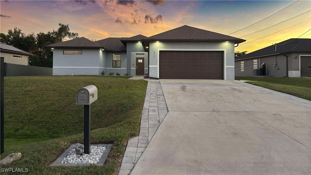 prairie-style house with a lawn and a garage