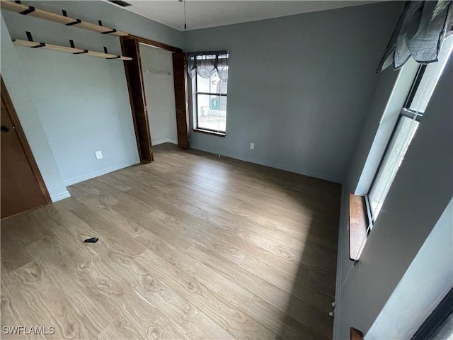 unfurnished bedroom with light hardwood / wood-style floors