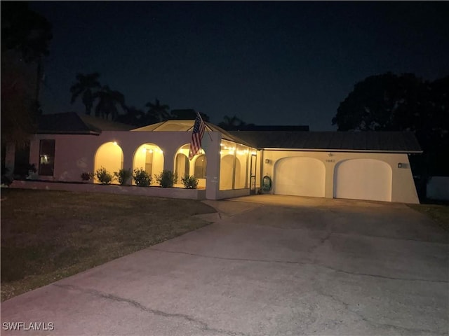 9882 Connecticut St, Bonita Springs, FL 34135 - ranch-style home featuring a garage, stucco siding, and concrete driveway