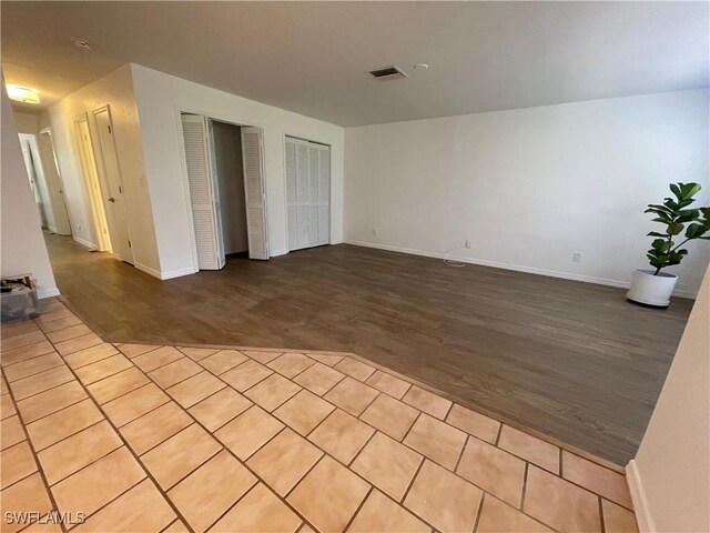 9882 Connecticut St, Bonita Springs, FL 34135 - empty room featuring visible vents, baseboards, and wood finished floors