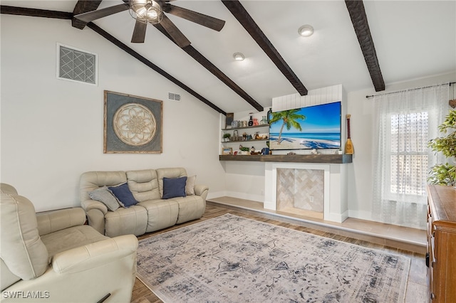 living room with lofted ceiling with beams, hardwood / wood-style floors, and ceiling fan