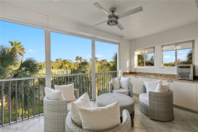 sunroom / solarium with ceiling fan and a healthy amount of sunlight