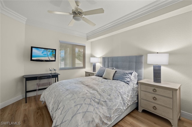 bedroom featuring ceiling fan, crown molding, and light hardwood / wood-style floors