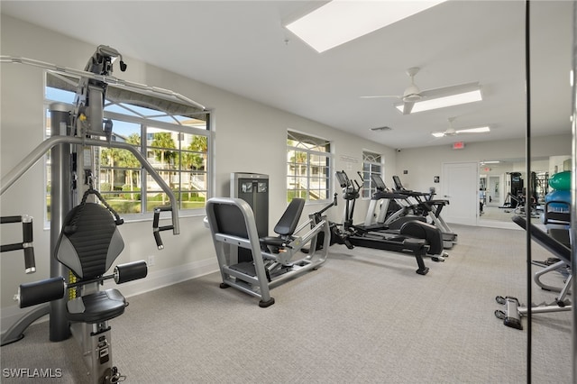 workout area with ceiling fan and carpet floors