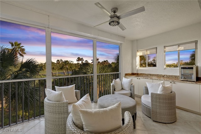 sunroom featuring ceiling fan