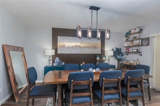 dining space with hardwood / wood-style floors