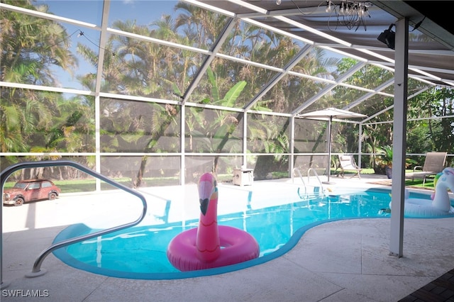 view of pool featuring a lanai and a patio