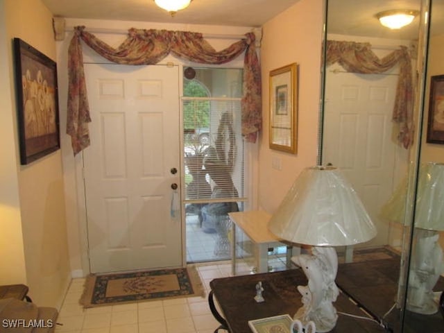 view of tiled foyer entrance