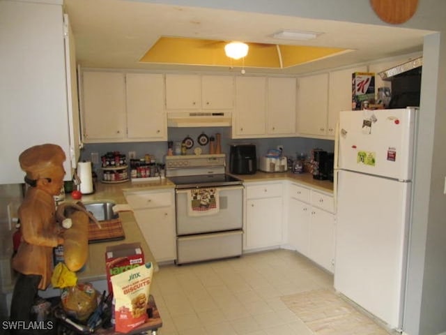 kitchen with white cabinets and white appliances