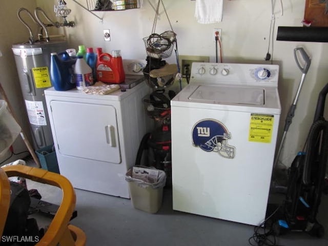 laundry area with water heater and independent washer and dryer