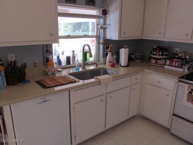 kitchen featuring white cabinets, sink, and white appliances