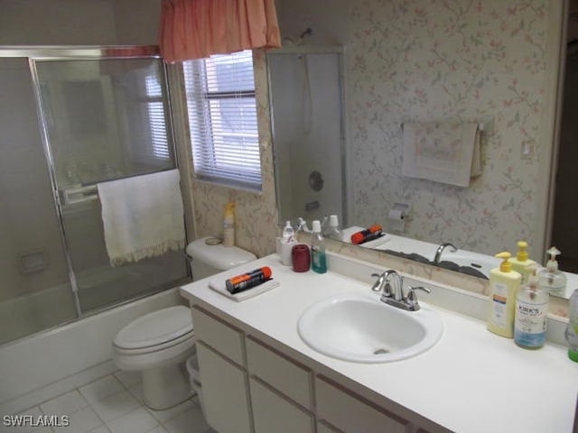 full bathroom with toilet, tile patterned floors, vanity, and enclosed tub / shower combo