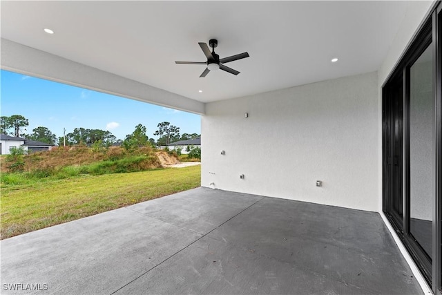 view of patio featuring ceiling fan