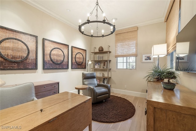 interior space with a notable chandelier, ornamental molding, and light hardwood / wood-style flooring