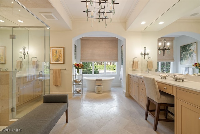 bathroom featuring a chandelier, plus walk in shower, vanity, and ornamental molding