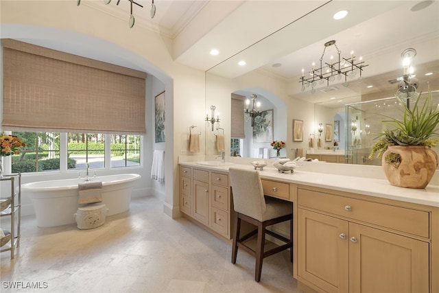 bathroom featuring ornamental molding, shower with separate bathtub, vanity, and a chandelier