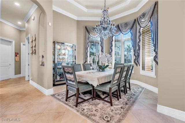 tiled dining room with ornamental molding and an inviting chandelier