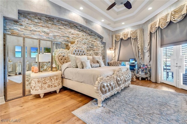 bedroom featuring ceiling fan, access to exterior, wood-type flooring, and ornamental molding