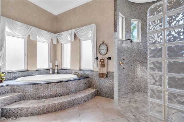 bathroom featuring tile patterned floors, crown molding, independent shower and bath, and tile walls