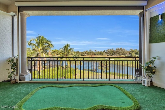 balcony featuring a water view