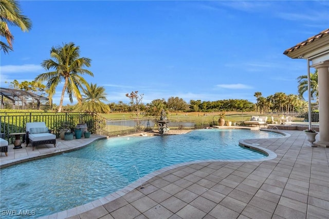 view of pool featuring pool water feature and a patio area