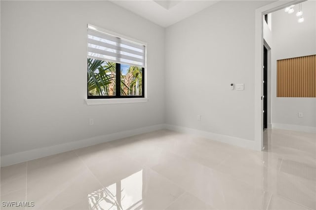 728 SW 8th Ter, Cape Coral, FL 33991 - tiled empty room featuring baseboards