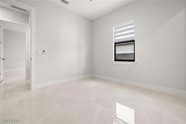 728 SW 8th Ter, Cape Coral, FL 33991 - empty room with tile patterned flooring and baseboards