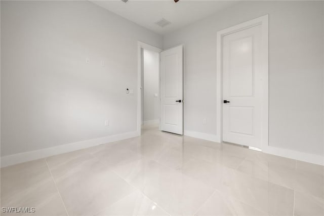 728 SW 8th Ter, Cape Coral, FL 33991 - unfurnished bedroom featuring baseboards and light tile patterned floors