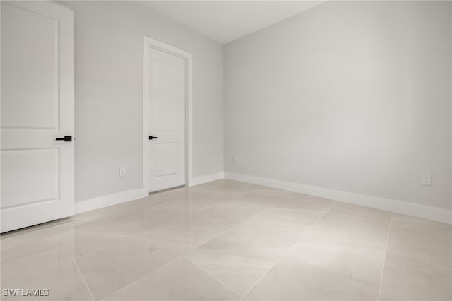 unfurnished bedroom with light tile patterned floors