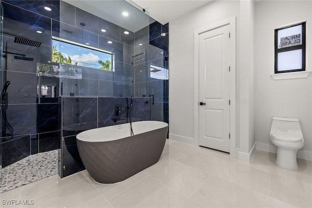 728 SW 8th Ter, Cape Coral, FL 33991 - full bathroom featuring tiled shower, a freestanding tub, tile patterned flooring, toilet, and baseboards