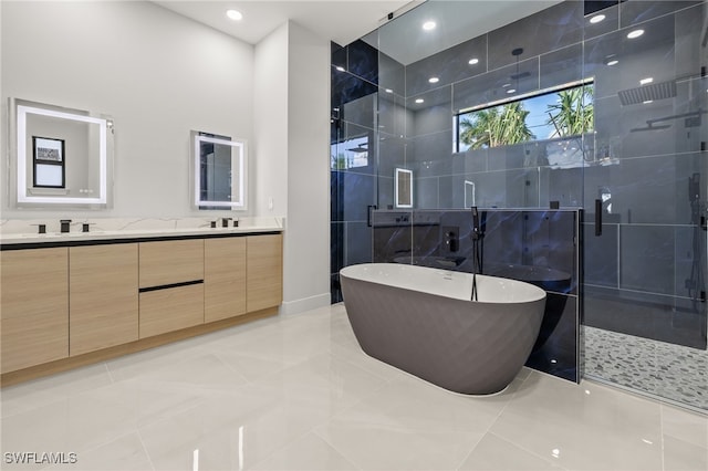 bathroom featuring tile walls, vanity, tile patterned flooring, and separate shower and tub