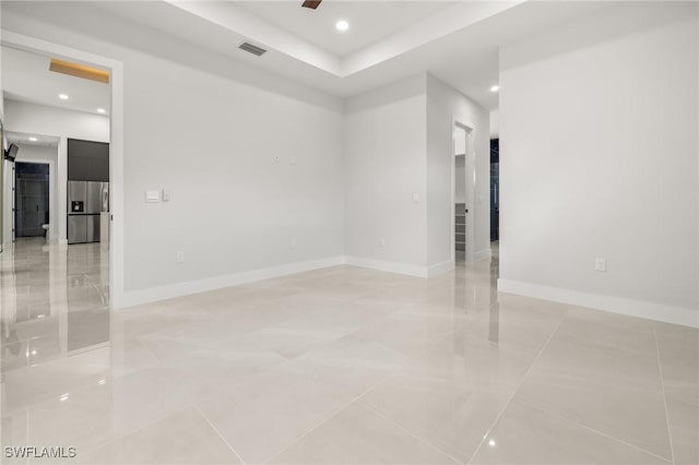 728 SW 8th Ter, Cape Coral, FL 33991 - spare room featuring recessed lighting, a barn door, baseboards, and light tile patterned flooring