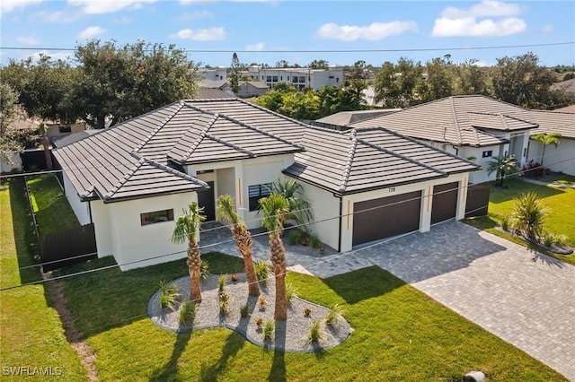 728 SW 8th Ter, Cape Coral, FL 33991 - single story home with a tile roof, decorative driveway, stucco siding, and an attached garage