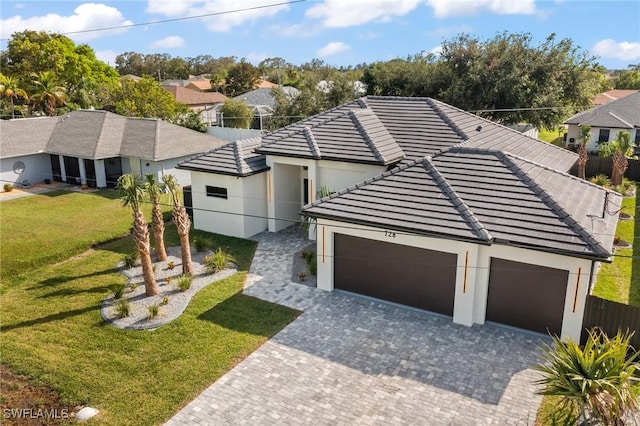 728 SW 8th Ter, Cape Coral, FL 33991 - view of front of house with an attached garage, a tile roof, decorative driveway, a residential view, and stucco siding