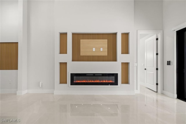 728 SW 8th Ter, Cape Coral, FL 33991 - detailed view of a glass covered fireplace and baseboards