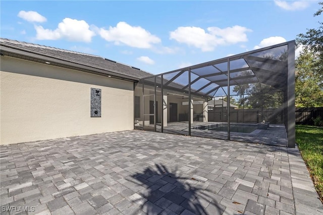 728 SW 8th Ter, Cape Coral, FL 33991 - view of patio with a fenced backyard, glass enclosure, and a ceiling fan