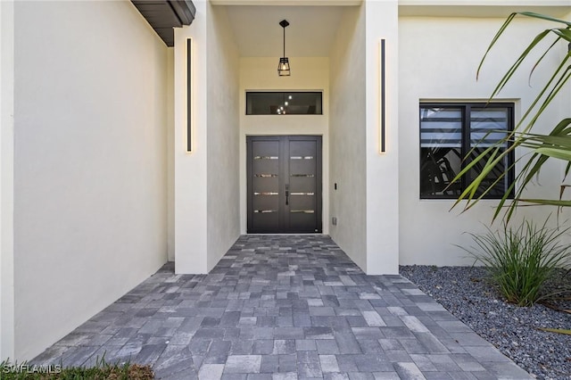 728 SW 8th Ter, Cape Coral, FL 33991 - property entrance featuring stucco siding and french doors