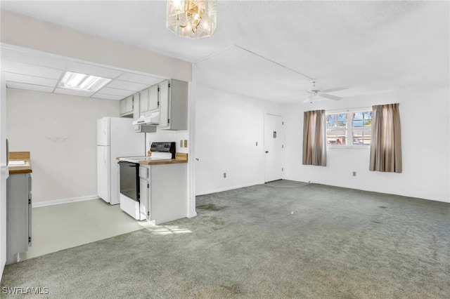 unfurnished living room with carpet and ceiling fan